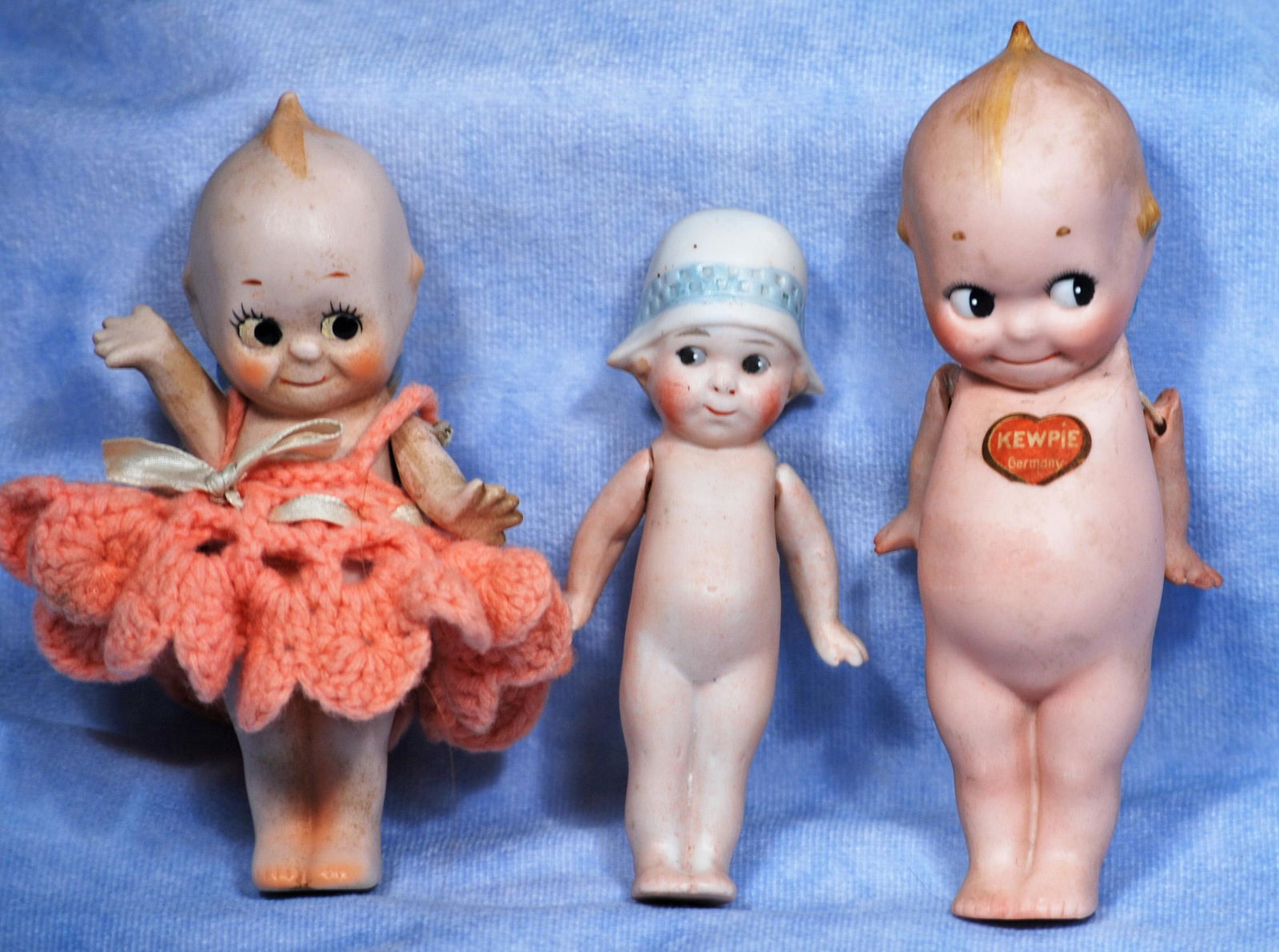 TWO BISQUE KEWPIES & ALL-BISQUE BONNET DOLL (1 of 1)