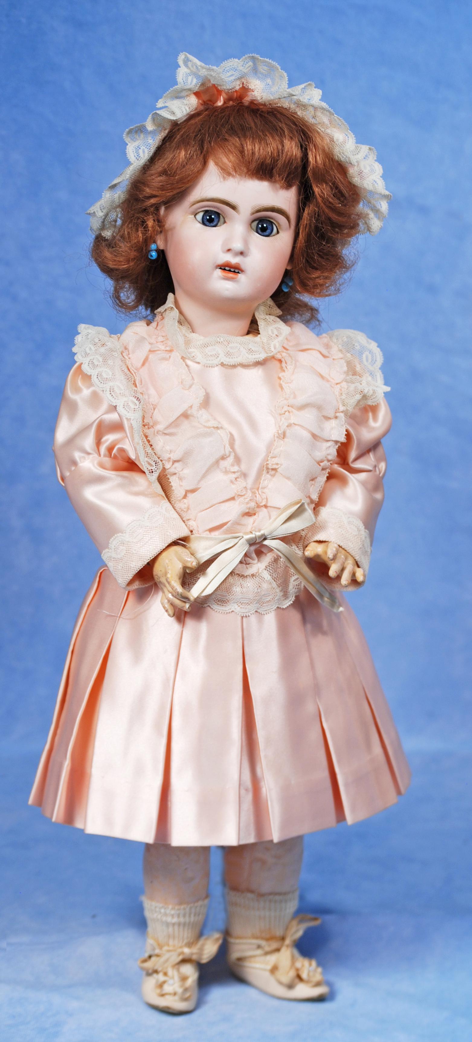 FRENCH BISQUE BEBE BY JUMEAU: FRENCH BISQUE BEBE BY JUMEAU. Marks: X 6. 18”. Bisque socket head, blue paperweight stationary eyes, painted lashes, feathered brows, pierced ears, open mouth, shaded and accented lips, upper te