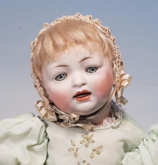 GERMAN BISQUE CHARACTER BABY BY HERTEL & SCHWAB: Marks: 152. 15". Bisque socket head, blue sleep eyes, painted lashes, feathered brows, open mouth, accented lips, upper teeth, original blonde mohair wig, composition bent-limb baby body, green nylon
