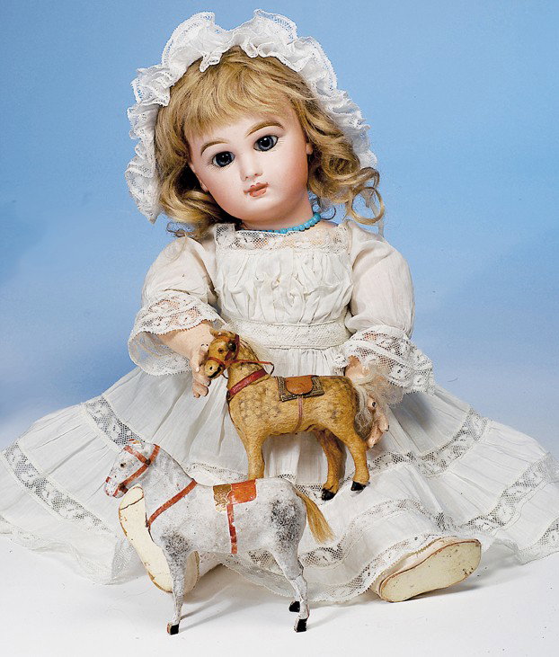 TWO MINIATURE GERMAN PAPIER MACHE HORSES: 4" dappled tan and gray horse wool covered horse, has tiny amber glass eyes, red bridle and breast strap, gray blanket and leather-cloth saddle; 4 ½" painted gray horse has tiny amber glass eyes, app