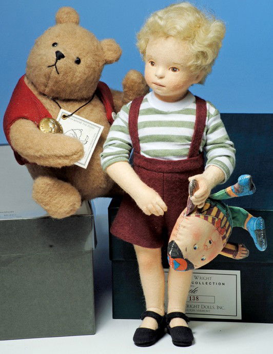 R. JOHN WRIGHT "COLE" AMERICAN CLOTH PORTRAIT DOLL: 12". All-felt doll with swivel head and jointed shoulders and hips, portraying a young boy with curly blonde hair, painted brown eyes, red and brown upper eyeliner, closed mouth with accent line betwe