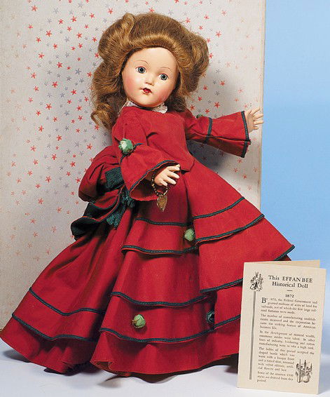 EFFANBEE COMPOSITION HISTORICAL DOLL REPRESENTING: Marks: Effanbee/Anne Shirley. 14". Composition socket head on five-piece jointed body, painted features, green eyes, painted lashes, tapered brows, closed mouth, rose-blushed cheeks, warm brown hair i