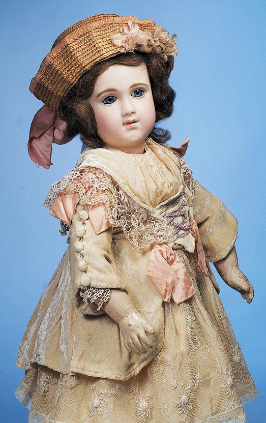 RARE FRENCH BISQUE "E.J.A." BEBE BY EMILE JUMEAU: Marks: E J A. 27". Bisque socket head with elongated facial modeling, blue paperweight eyes, dark eye-liner, painted lashes, multi-feathered and brushstroked brows, closed mouth with shaded lips and h