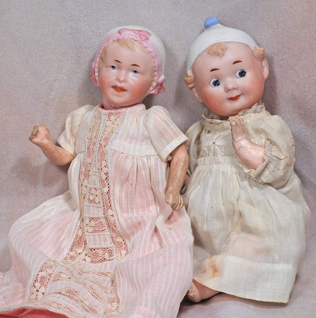 TWO GERMAN BISQUE BABIES WITH SCULPTED BONNET (1 of 1)