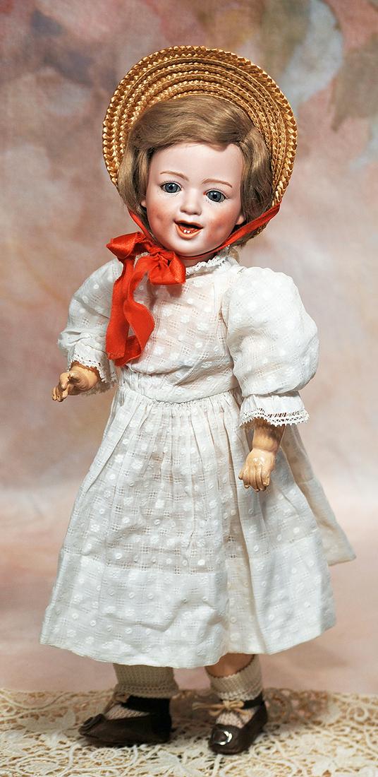 GERMAN BISQUE “LAUGHING CHILD” BY GEBRUDER HEUBACH: 75. GERMAN BISQUE “LAUGHING CHILD” BY GEBRUDER HEUBACH. 16”. Marks: 5636 Heubach sunburst mark, Germany. Bisque socket head, blue sleep eyes, painted curly lashes, feathered brows, o