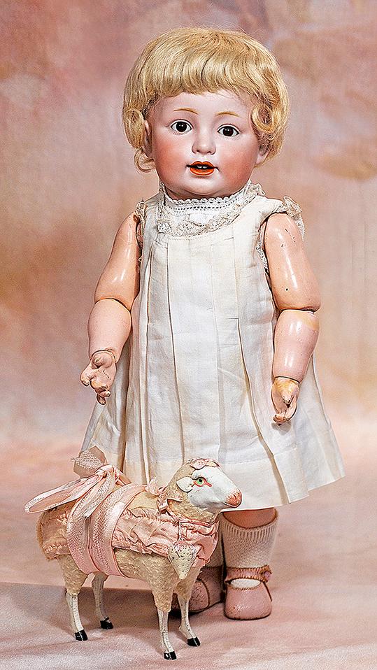 KESTNER BISQUE CHARACTER, 220, WITH TODDLER BODY: 77. KESTNER BISQUE CHARACTER, 220, WITH TODDLER BODY. 14”. Marks: G. made in Germany 11, JDK 220. Bisque socket head, brown sleep eyes, dark eyeliner, painted short curly lashes, feathered brows