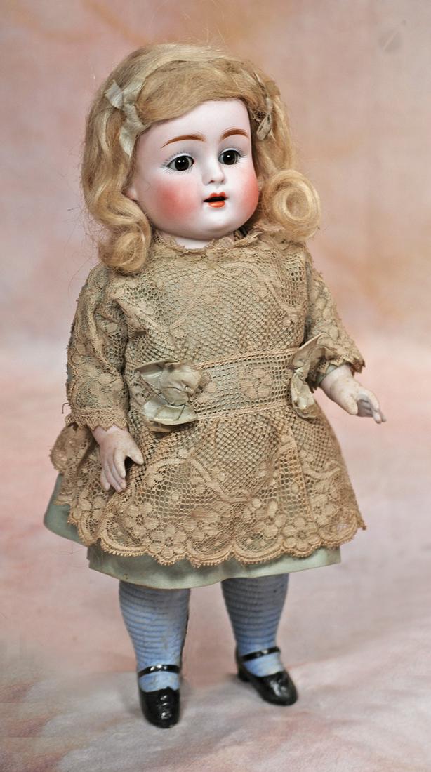 FINE LARGE KESTNER ALL-BISQUE CHILD: 103. FINE LARGE KESTNER ALL-BISQUE CHILD. 10”. Marks: 150. 5. All-bisque doll jointed at shoulders and hips with plump modeling, brown sleep eyes, painted lashes, feathered brows, open mouth, ac
