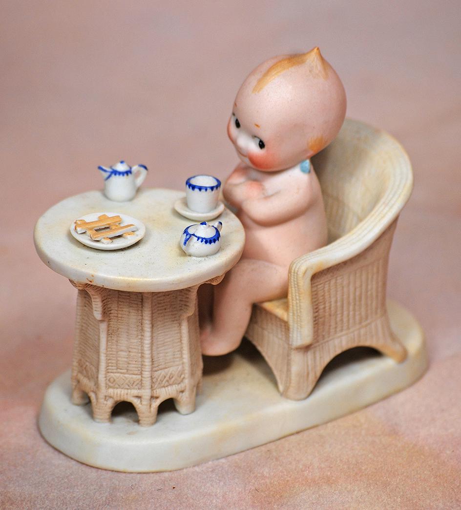 GERMAN BISQUE KEWPIE HAVING TEA AND COOKIES (1 of 1)
