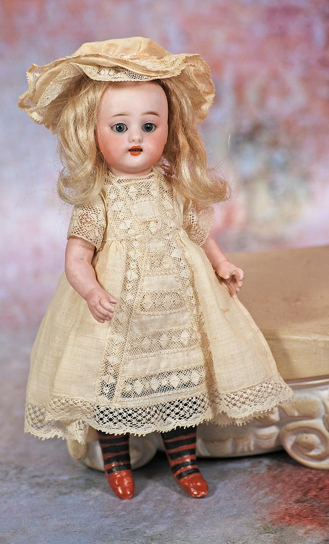 SIMON & HALBIG ALL-BISQUE BLACK STOCKING DOLL WITH AU NAIN BLUE SHOP LABEL: 3. SIMON & HALBIG ALL-BISQUE BLACK STOCKING DOLL WITH AU NAIN BLUE SHOP LABEL. 7 ½”. Marks: S 6 H. Bisque socket head, blue sleep eyes, painted lashes, feathered brows, open mouth, upper te