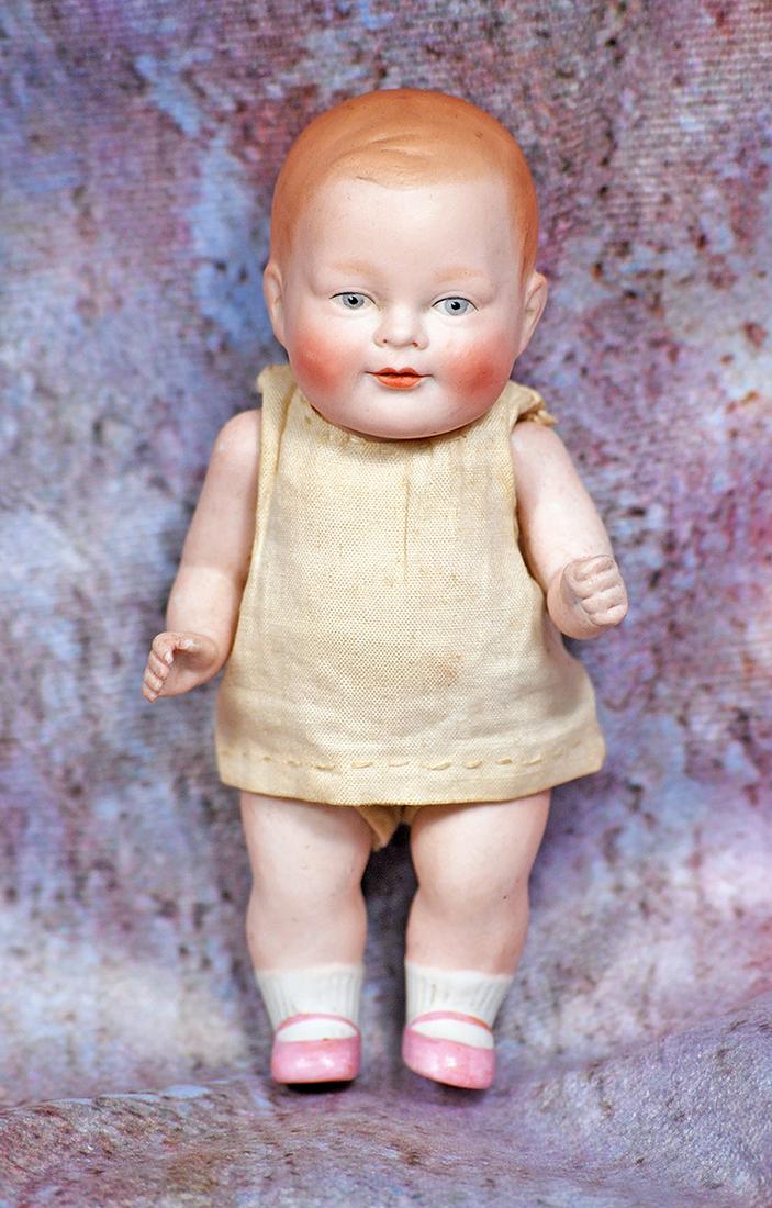 RARE ALL-BISQUE “MILDRED THE PRIZE BABY”: 40. RARE ALL-BISQUE “MILDRED THE PRIZE BABY”. 5”. Marks: Copr. By Mildred The Prize Baby (incised). All-bisque with sculpted and painted light brown hair, painted blue eyes, upper ey
