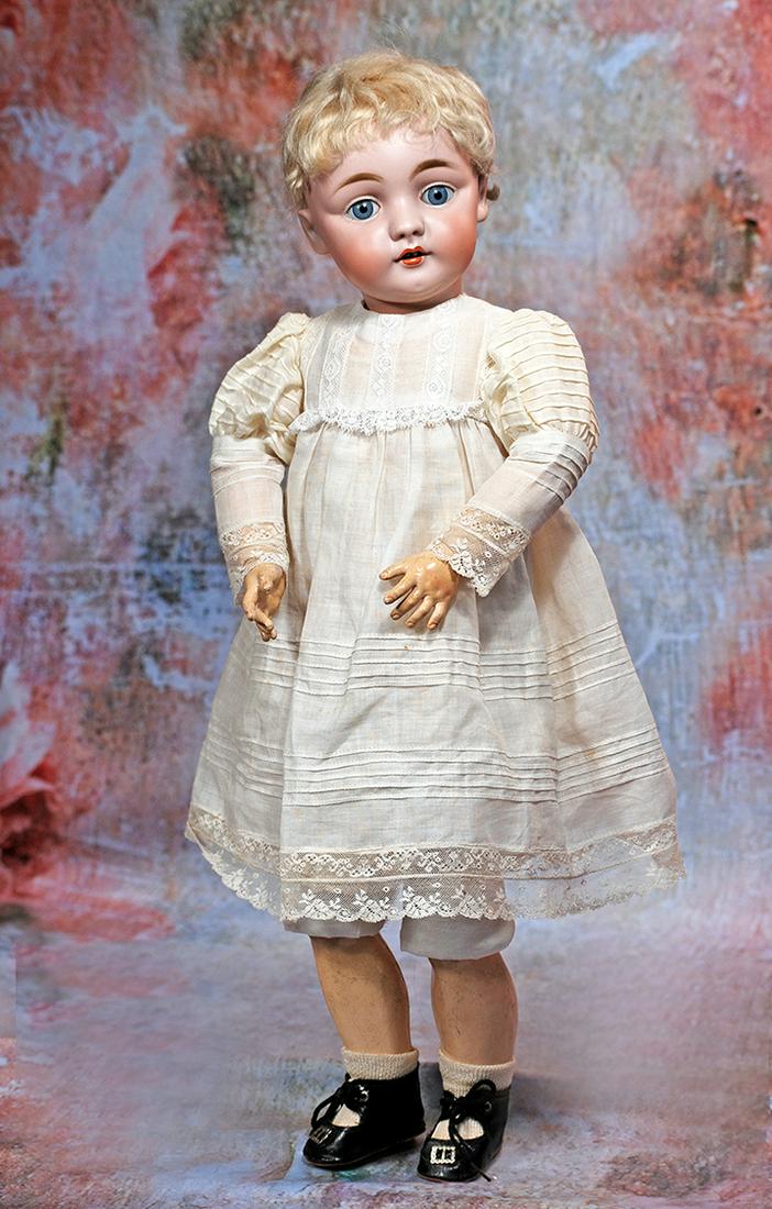 LARGE GERMAN BISQUE, 143, MODEL BY KESTNER: 113. LARGE GERMAN BISQUE, 143, MODEL BY KESTNER. 22”. Marks: J. made in Germany 13. 143. Bisque socket head, blue sleep eyes, painted lashes, feathered brows, plump cheeks, open mouth, accented