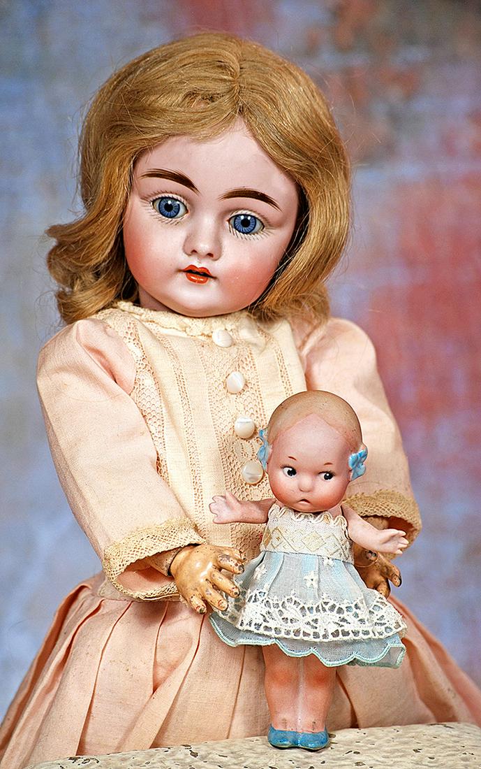 GERMAN BISQUE DOLL BY KESTNER: 163. GERMAN BISQUE DOLL BY KESTNER. 13”. Marks: C made in Germany 7. Bisque socket head, blue sleep eyes, painted lashes, feathered brows, open mouth, accented lips, two upper teeth, blonde huma
