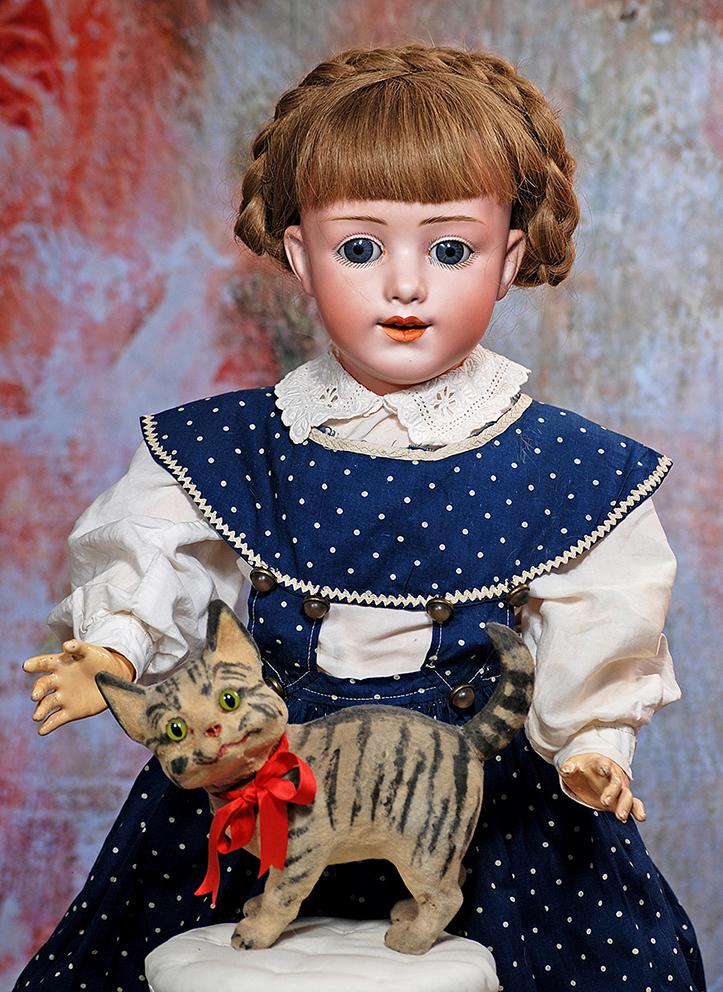 RARE GERMAN BISQUE CHARACTER, 5689, BY HEUBACH: 208. RARE GERMAN BISQUE CHARACTER, 5689, BY HEUBACH. 24”. Marks: Heubach (sunburst mark) 11. Bisque socket head, large blue glass sleep eyes, painted curly lashes, eyeliner, fringed brows, open