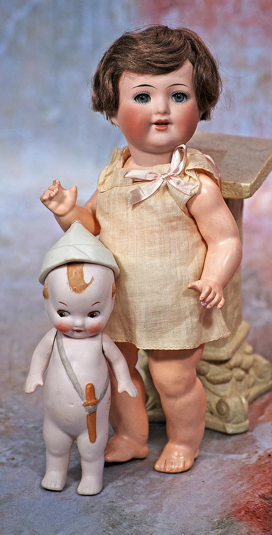 PETITE GERMAN BISQUE TODDLER, 156, BY SIMON & HALBIG FOR ADOLPH HULSS: 238. PETITE GERMAN BISQUE TODDLER, 156, BY SIMON & HALBIG FOR ADOLPH HULSS. 9”. Marks: Simon & Halbig AHW/ 156. Bisque socket head, blue sleep eyes, painted lashes and applied upper lashes, tape