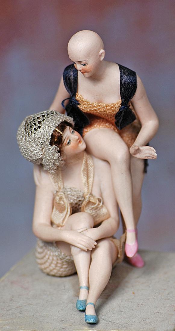 RARE GERMAN BISQUE DOUBLE BATHING BEAUTIES BY GALLUBA AND HOFFMAN: 243. RARE GERMAN BISQUE DOUBLE BATHING BEAUTIES BY GALLUBA AND HOFFMAN. 5” (13 cm.) A bisque nude woman is posed seated, her knees drawn up and clasped, as she turns her head to speak with the o