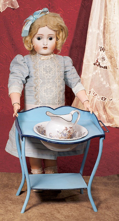 FRENCH ENAMELWARE WASHSTAND WITH TOLE PAINTED ACCESS: FRENCH ENAMELWARE WASHSTAND WITH TOLE PAINTED ACCESSORIES. 11 ½" h. x 10" w. Blue enamelware washstand with graceful curved detail which is outlined in black enamel, has towel bar and bottom shelf; i