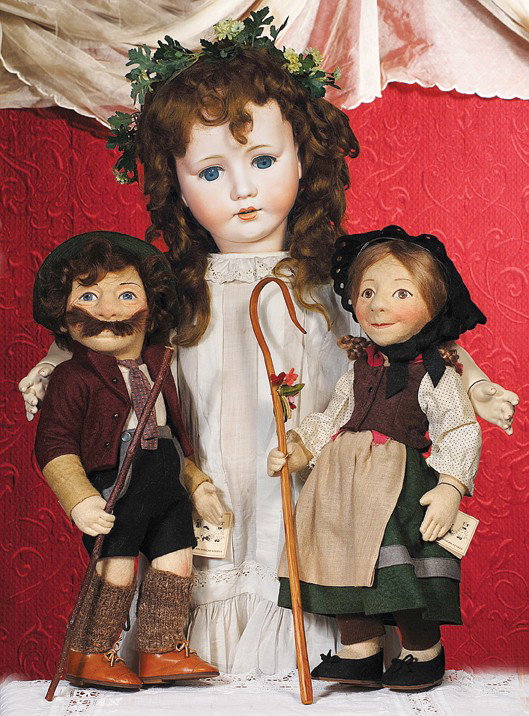 R. JOHN WRIGHT EARLY CHARACTER DOLL "GRETCHEN". 1: R. JOHN WRIGHT EARLY CHARACTER DOLL "GRETCHEN". 18". Molded felt with unique character features, wide beaming smile, prominent nose, brown eyes, light brown hair in looped braids, jointed at shoulders