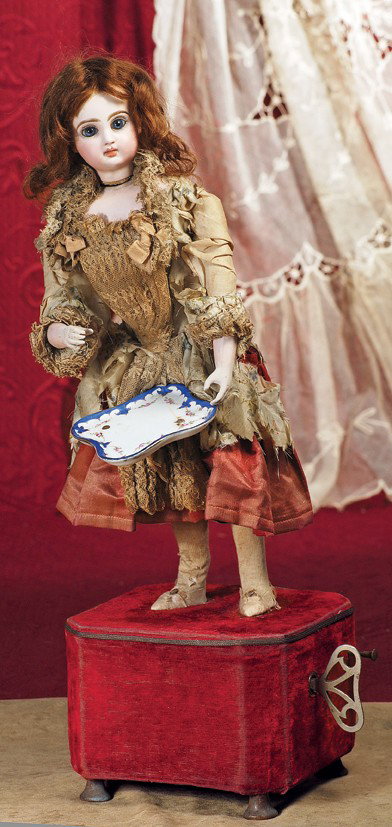 FRENCH AUTOMATON "GIRL SERVING TEA" BY GUSTAV VICH: FRENCH AUTOMATON "GIRL SERVING TEA" BY GUSTAV VICHY. 19". Marks: Tete Jumeau Depose 4 (head). 19". Bisque head with blue paperweight eyes, painted lashes, feathered brows, closed mouth, brown mohair w