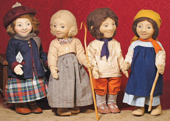 R. JOHN WRIGHT CHARACTER DOLL "MARION". 17". Mold: R. JOHN WRIGHT CHARACTER DOLL "MARION". 17". Molded felt with unique character features, wide beaming smile, prominent nose, brown eyes, side-parted brown mohair wig, jointed at shoulders and hips, we