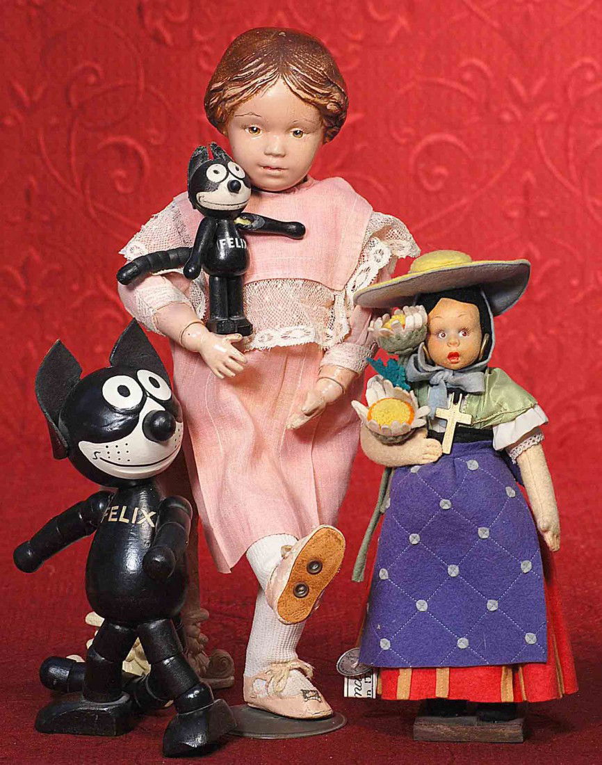 ALL-ORIGINAL LENCI MASCOTTE.: ALL-ORIGINAL LENCI MASCOTTE. Marks: Lenci silver circular tag and cloth tag. Felt head and arms, cloth legs, painted features, brown side-glancing eyes, upper lashes, arched brows, black mohair wig, c