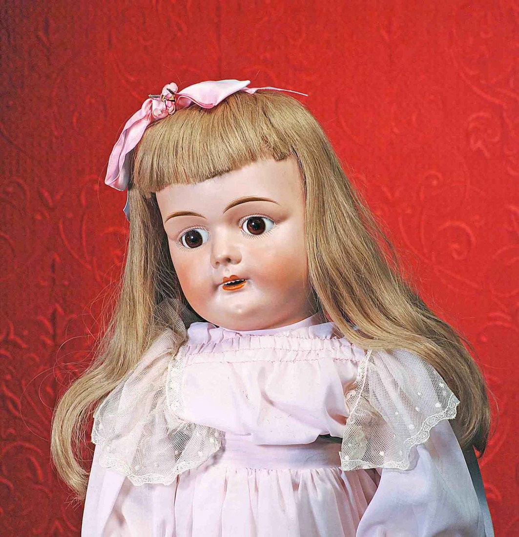 FRENCH BISQUE DOLL WITH CHARACTER-LOOK BY MYSTERY : FRENCH BISQUE DOLL WITH CHARACTER-LOOK BY MYSTERY MAKER. Marks: Paris D (red stamp); 14 (incised). 28". Bisque socket head, stationary set brown glass eyes, painted lashes, feathered brows, open mouth