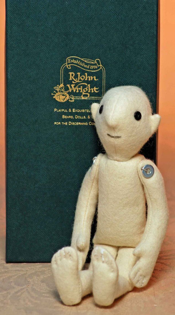 R. JOHN WRIGHT “THE FIRST DOLL – REPLICA”.: R. JOHN WRIGHT “THE FIRST DOLL – REPLICA”. 9”. Made of ivory felt and similarly constructed and 'detailed' - down to the metal washer joints and button eyes. This is #231 from the special comm