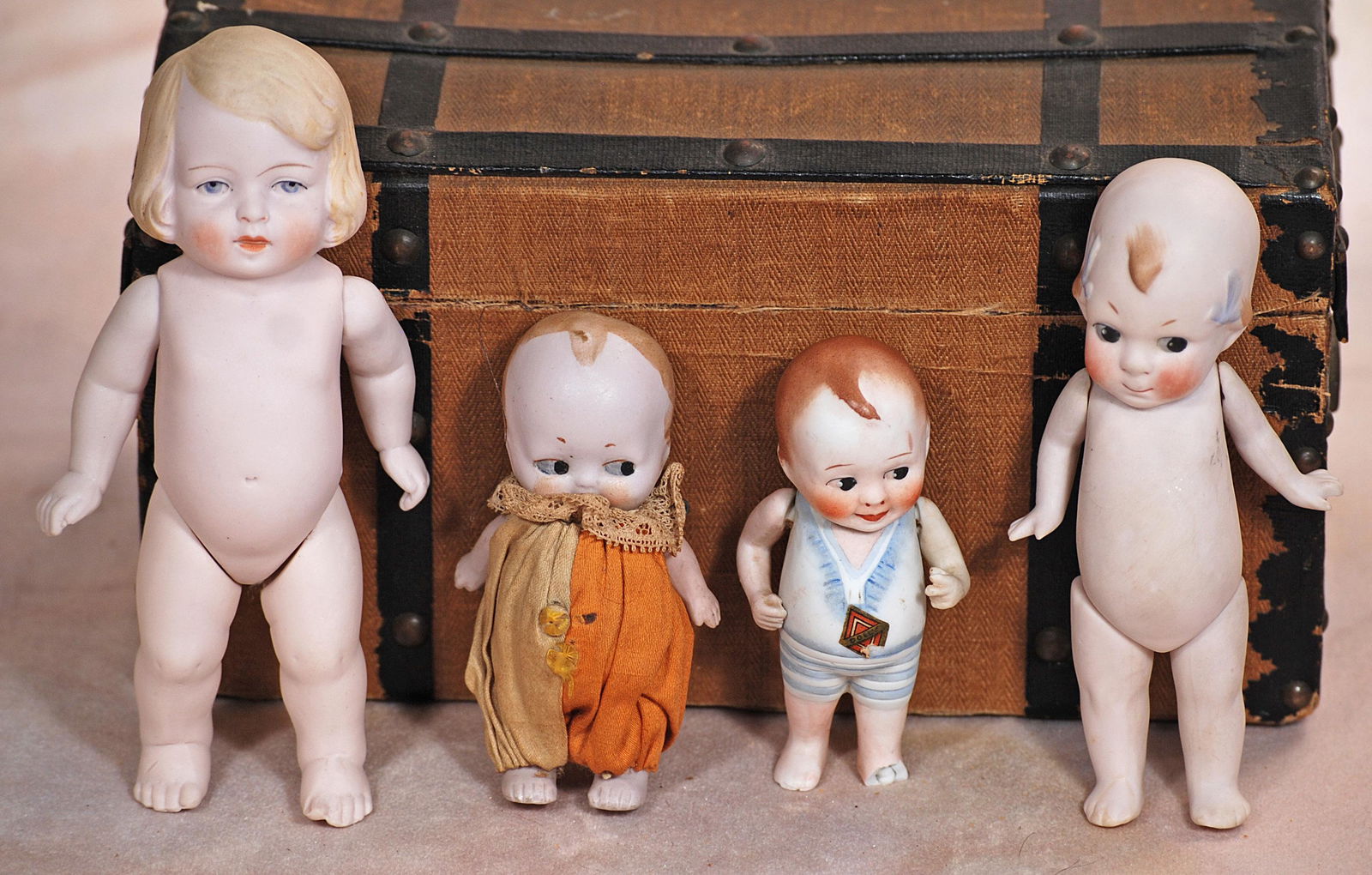 FOUR GERMAN ALL-BISQUE DOLLS (1 of 1)