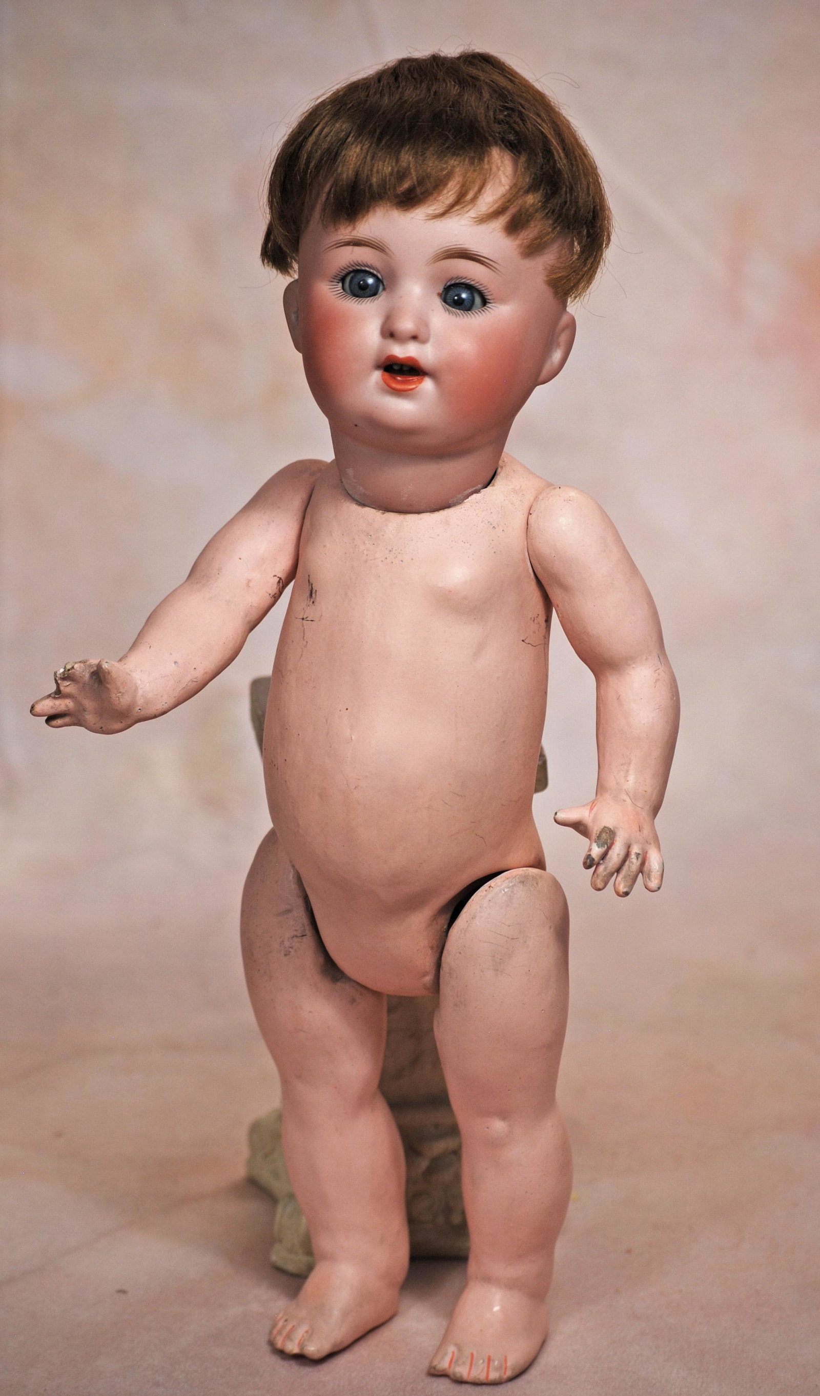 GERMAN BISQUE TODDLER CHARACTER 201 BY CATTERFELDER PUPPENFABRIK: GERMAN BISQUE TODDLER CHARACTER 201 BY CATTERFELDER PUPPENFABRIK. 13”. Marks: 201 Germany. Bisque socket head, blue sleep eyes, painted lashes, feathered brows, open mouth, accented lips, upper