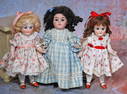 THREE GERMAN ALL-BISQUE DOLLS.