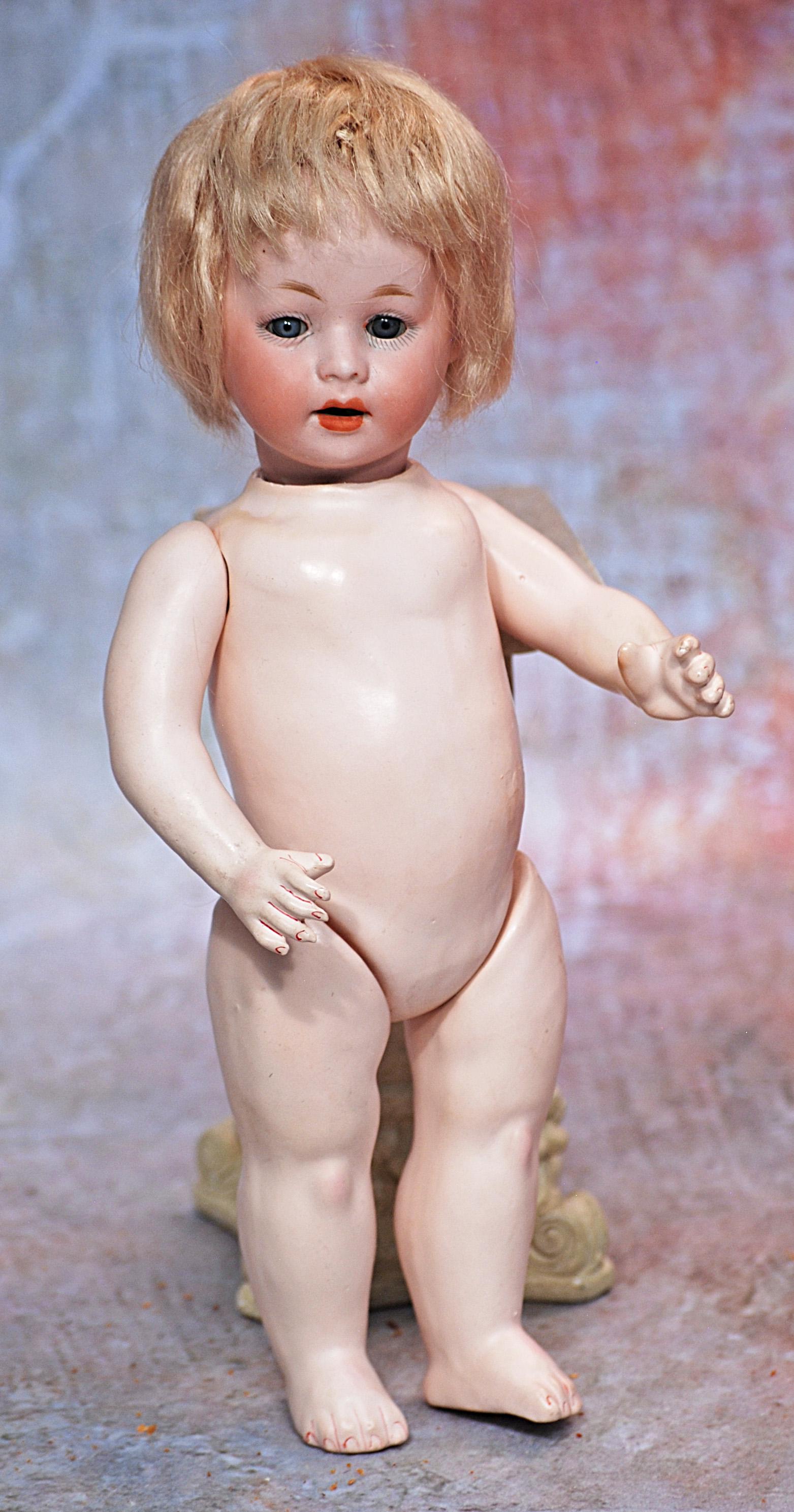GERMAN BISQUE A.M. CHARACTER, 233, WITH TODDLER BODY: GERMAN BISQUE A.M. CHARACTER, 233, WITH TODDLER BODY. 10”. Marks: Germany 233 A 0/M 6. Bisque socket head, blue sleep eyes, painted lashes, feathered brows, open mouth, upper teeth, original blo