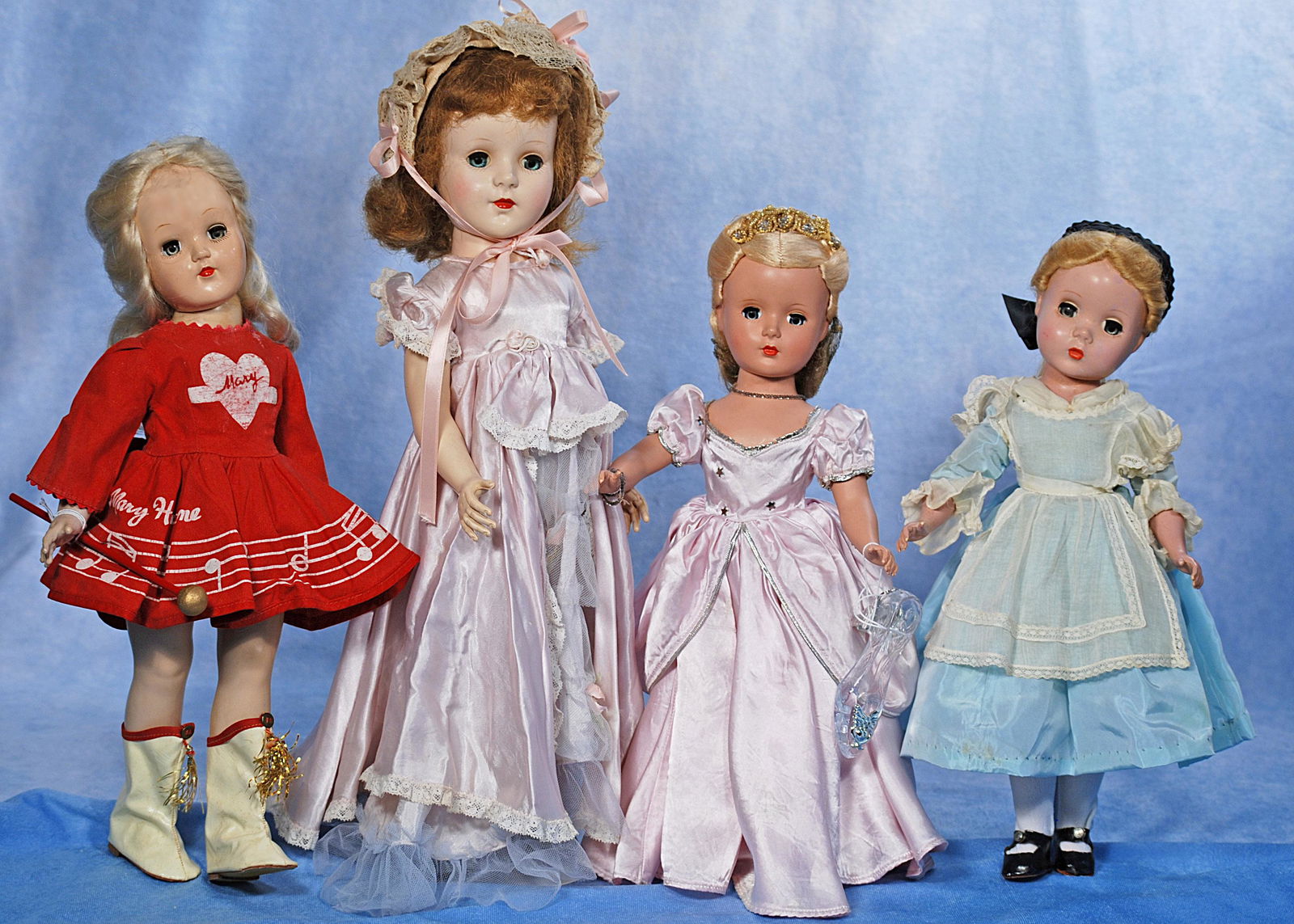 FOUR HARD PLASTIC DOLLS (1 of 1)