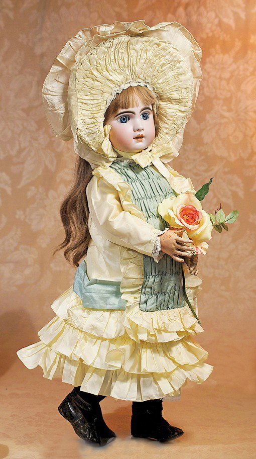 LARGE FRENCH BISQUE BEBE BY JUMEAU: LARGE FRENCH BISQUE BEBE BY JUMEAU. Marks: 12. Bisque socket head, blue paperweight eyes, painted lashes, eyeliner, feathered and brushstroked brows, pierced ears, light brown human hair wig, French w