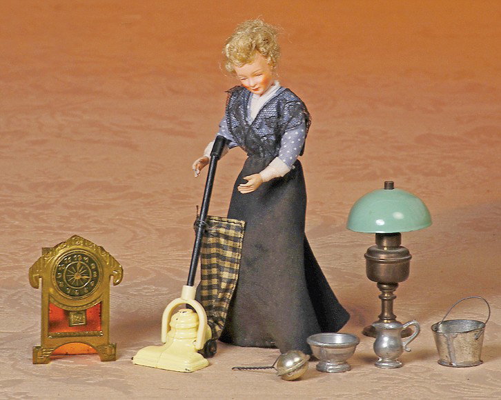 DOLL HOUSE DOLL & FURNISHINGS: DOLL HOUSE DOLL & FURNISHINGS. Includes: 2" H. tinplate mantel clock 4 ¼" metal sweeper marked "England"; 5 ½" dollhouse lady with poseable wrapped cloth body; silver-finished bed warment, pitcher, 