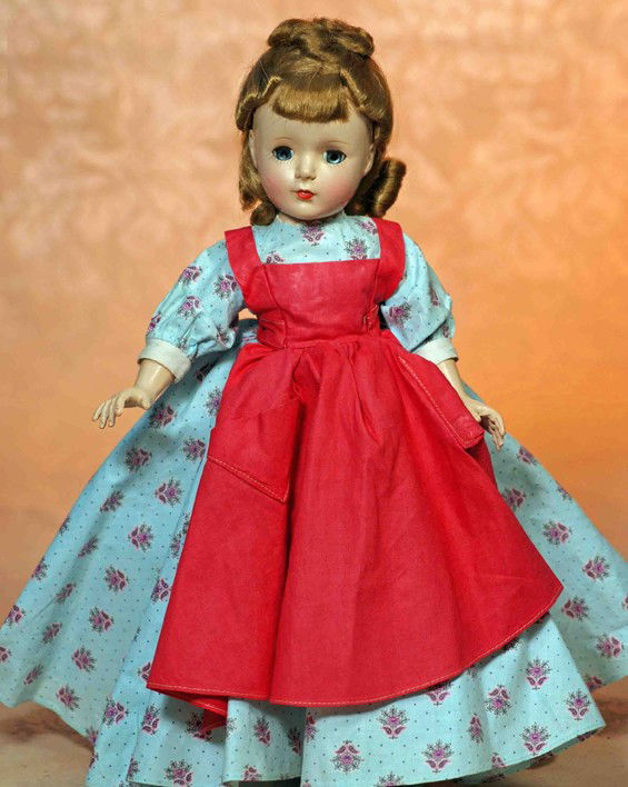 ALEXANDER LITTLE WOMEN "MEG" HARD PLASTIC DOLL: ALEXANDER LITTLE WOMEN "MEG" HARD PLASTIC DOLL. 15". Hard plastic socket head, five-piece jointed body, light brown wig, sleep eyes, painted and applied lashes, eyeshadow, ruby lips, tagged light blue