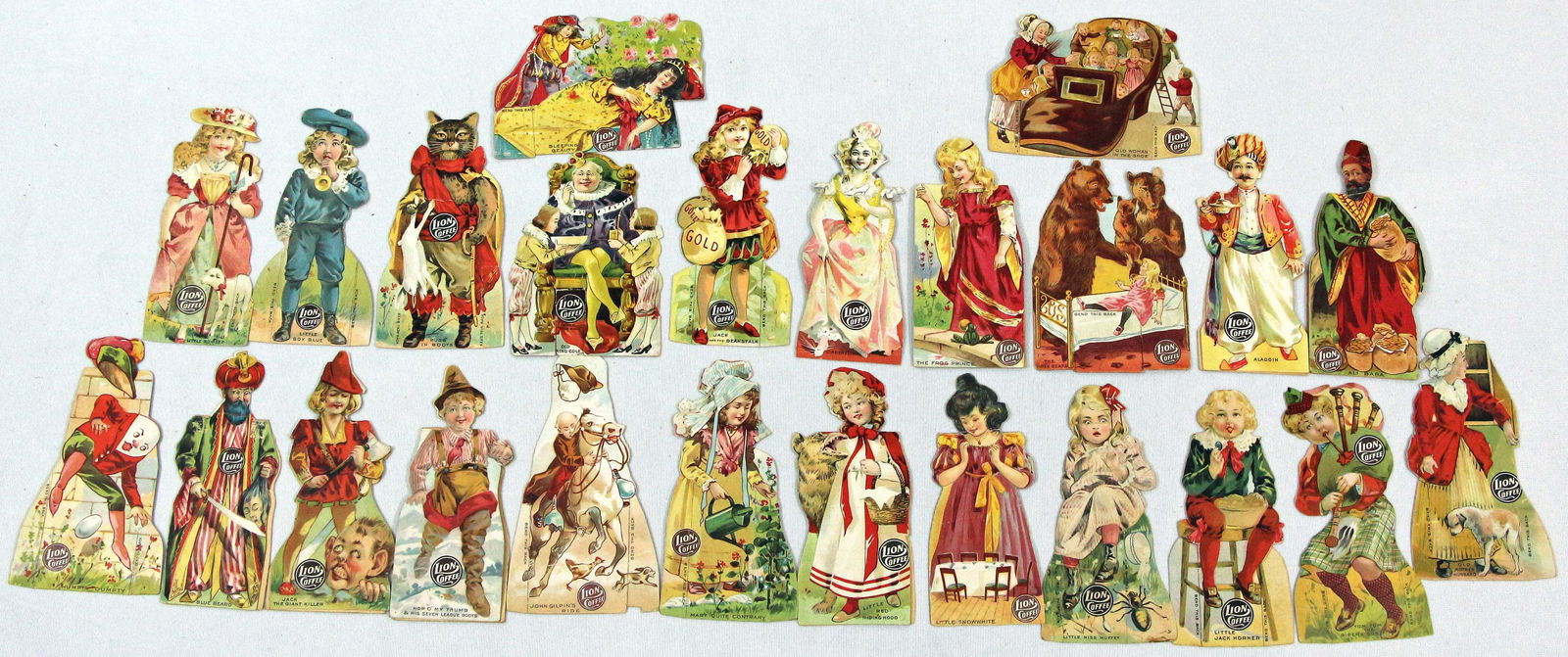 TWENTY-FOUR (24) LION COFFEE ADVERTISING PAPER DOLLS. (1 of 2)