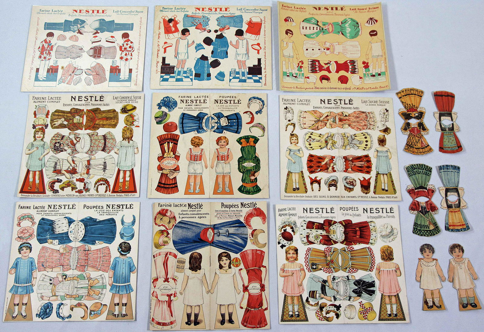 TEN FRENCH UNCUT PAPER DOLL SHEETS WITH NESTLE’S ADVERTISING (1 of 2)