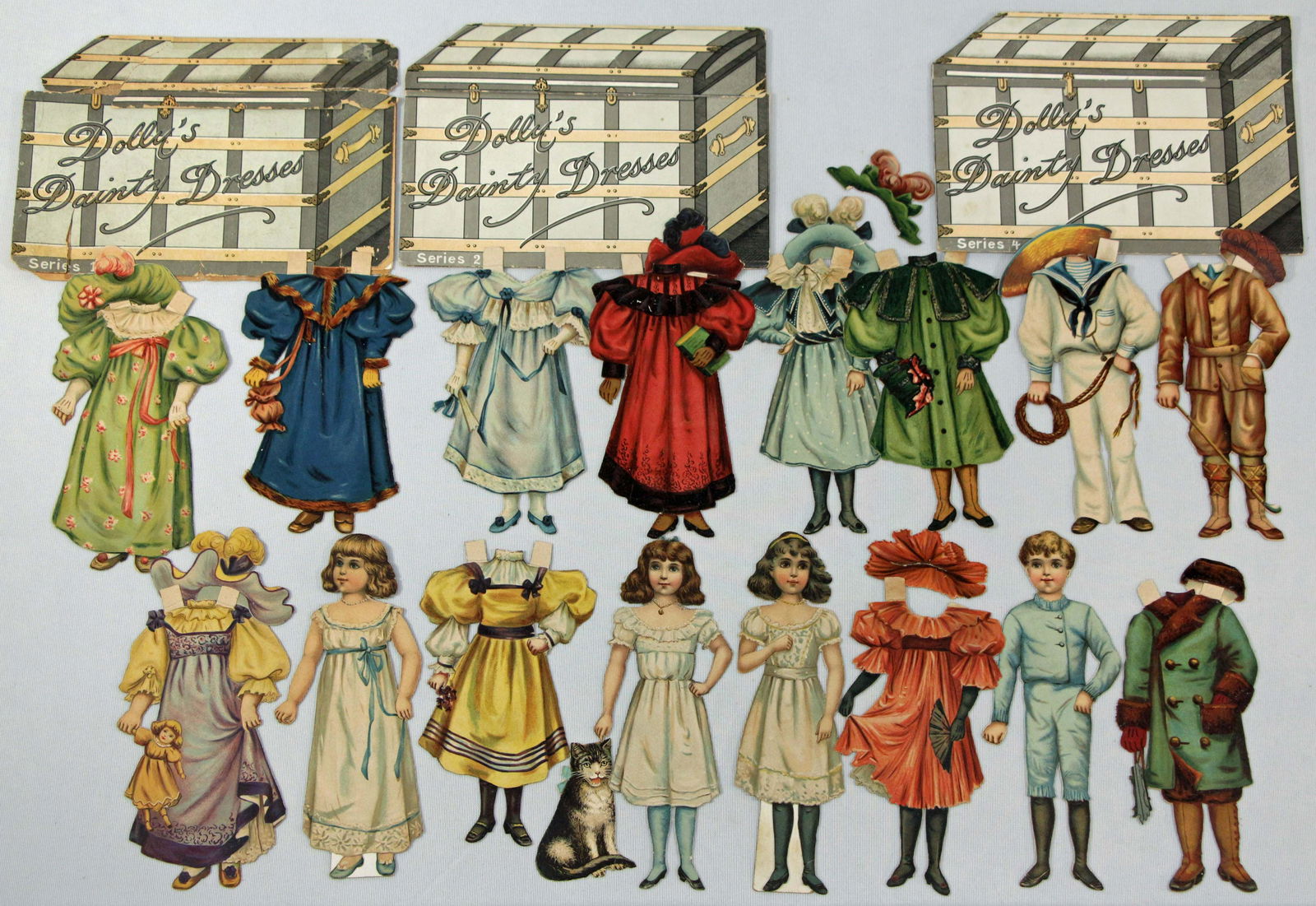 RAPHAEL TUCK "DOLLY’S DAINTY DRESSES" FOUR SETS (1 of 2)