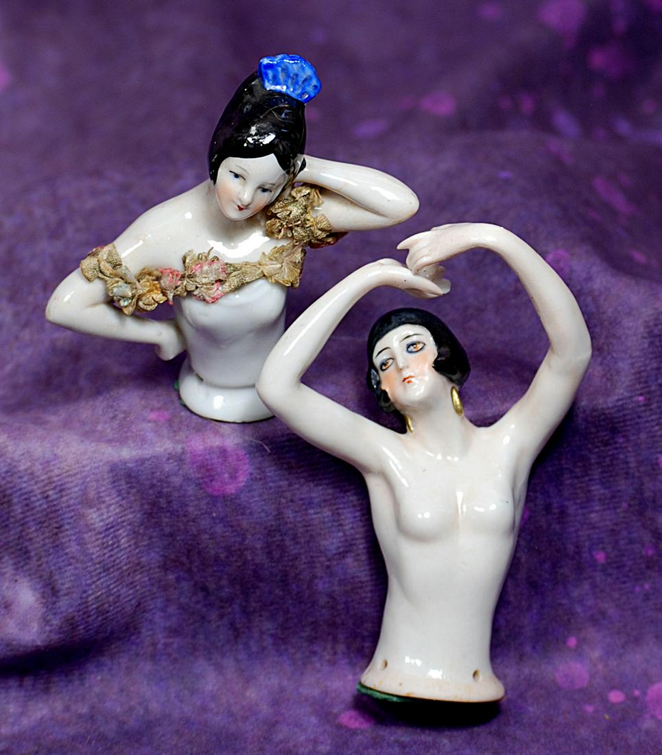 TWO GERMAN PORCELAIN HALF DOLLS.  Each is waist-up figure of lady with sculpted black hair and (1 of 1)