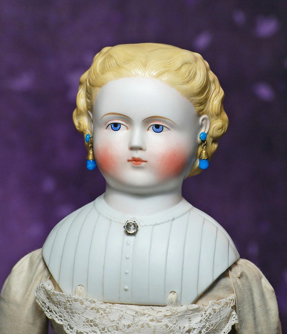 GERMAN BISQUE LADY WITH YOUTHFUL LOOK. 21”. Bisque shoulderhead with sculpted blonde hair: GERMAN BISQUE LADY WITH YOUTHFUL LOOK. 21”. Bisque shoulderhead with sculpted blonde hair waved away from face and secured at the back by braided detail and black hair ribbon, pierced ears, anti