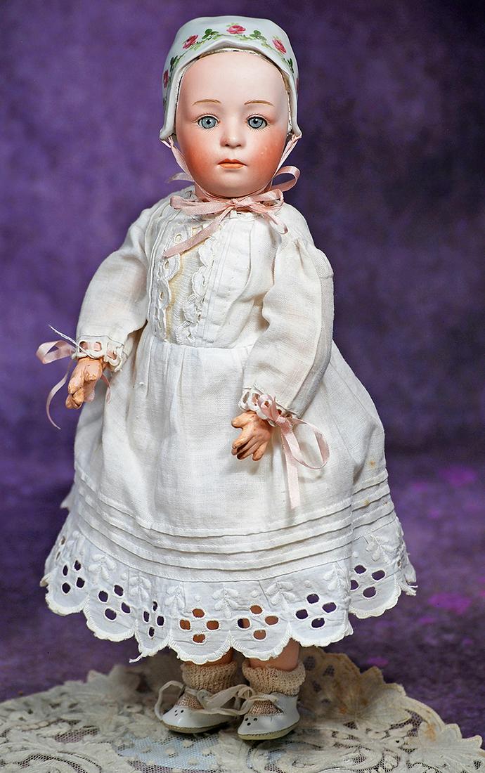 RARE GEBRUDER HEUBACH “BABY STUART” WITH REMOVABLE BONNET AND GLASS EYES. 12”.: RARE GEBRUDER HEUBACH “BABY STUART” WITH REMOVABLE BONNET AND GLASS EYES. 12”. Marks: 4 Germany Heubach (sunburst mark) 7975. Bisque socket head with detachable bisque Dutch cap bonn