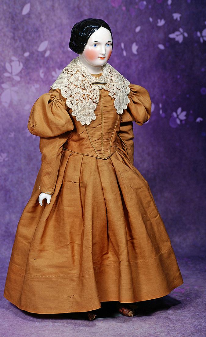 GERMAN PORCELAIN LADY WITH CHIGNON ATTRIBUTED TO KISTER.  20”.  Porcelain shoulderhead with (1 of 3)