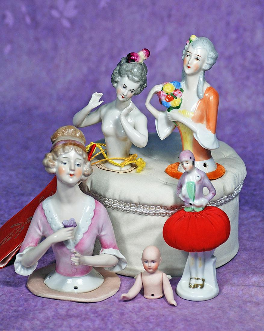 FOUR GERMAN PORCELAIN AND BISQUE HALF DOLLS.  5” porcelain lady with upswept café aulait (1 of 1)