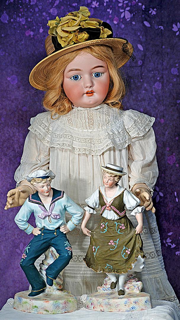 PAIR OF GERMAN BISQUE FIGURINES BY HEUBACH.  12”.  Marks: Heubach blue stamp.  Pair of (1 of 2)