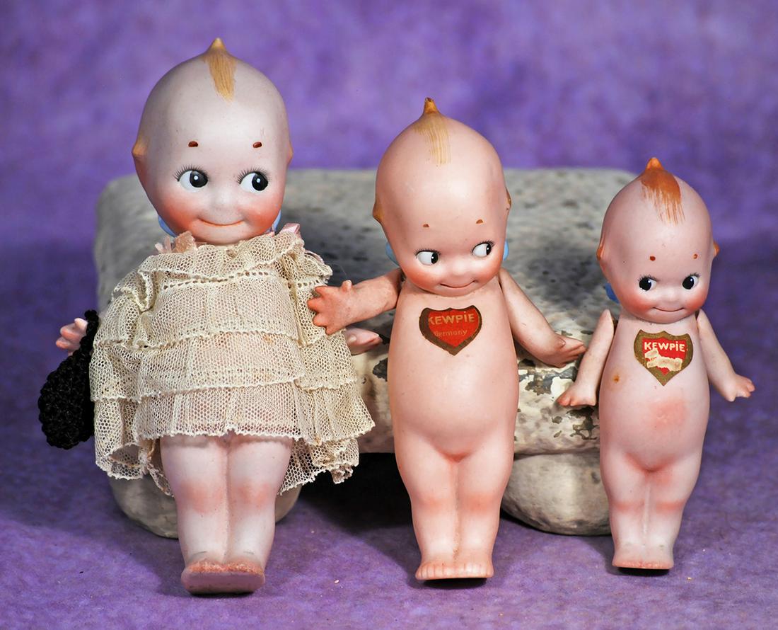 THREE GERMAN BISQUE KEWPIES.  4 ½” to 6”.  Each is all-bisque with painted classic (1 of 1)