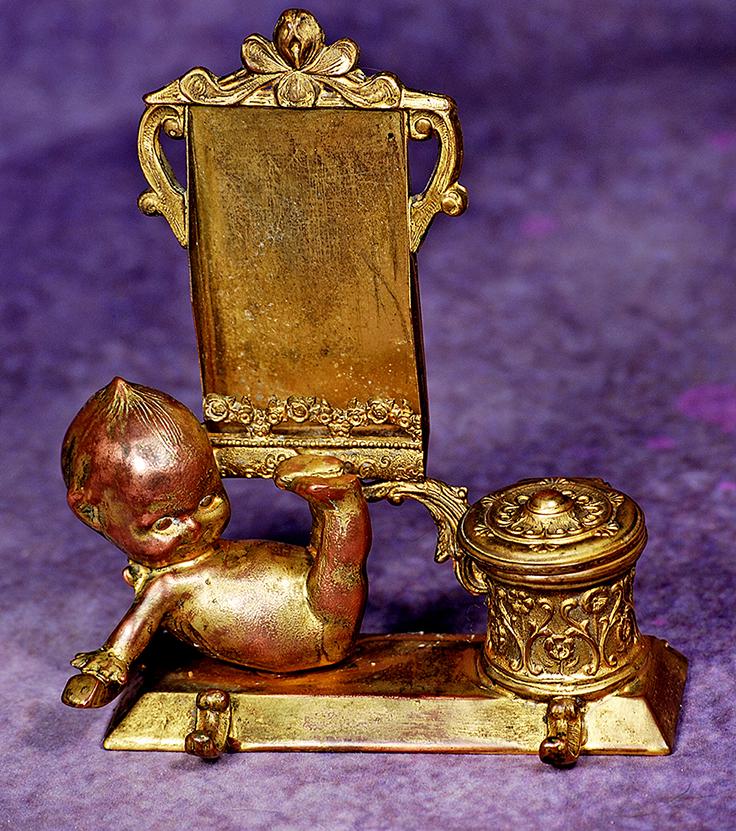 RARE CAST METAL KEWPIE INKWELL & PEN WITH GILT FINISH.  6 ½” x 5”.  Gilded metal (1 of 1)
