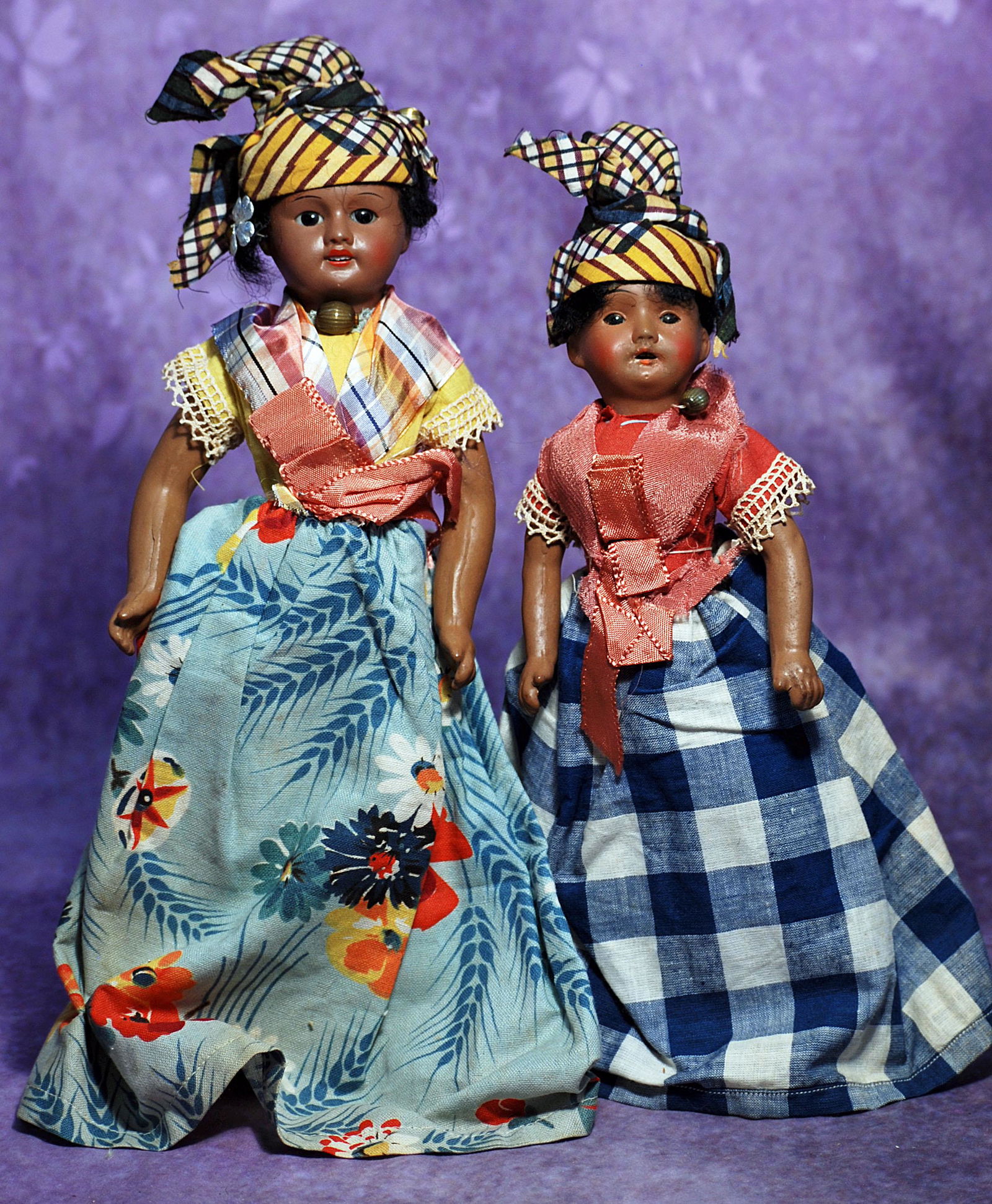 TWO BROWN BISQUE FRENCH DOLLS BY S.F.B.J. 9” and 12”. Marks: Unis France 60 (on: TWO BROWN BISQUE FRENCH DOLLS BY S.F.B.J. 9” and 12”. Marks: Unis France 60 (on 12” doll). Each is brown-complexioned painted bisque socket head, black glass inset eyes, painted lash