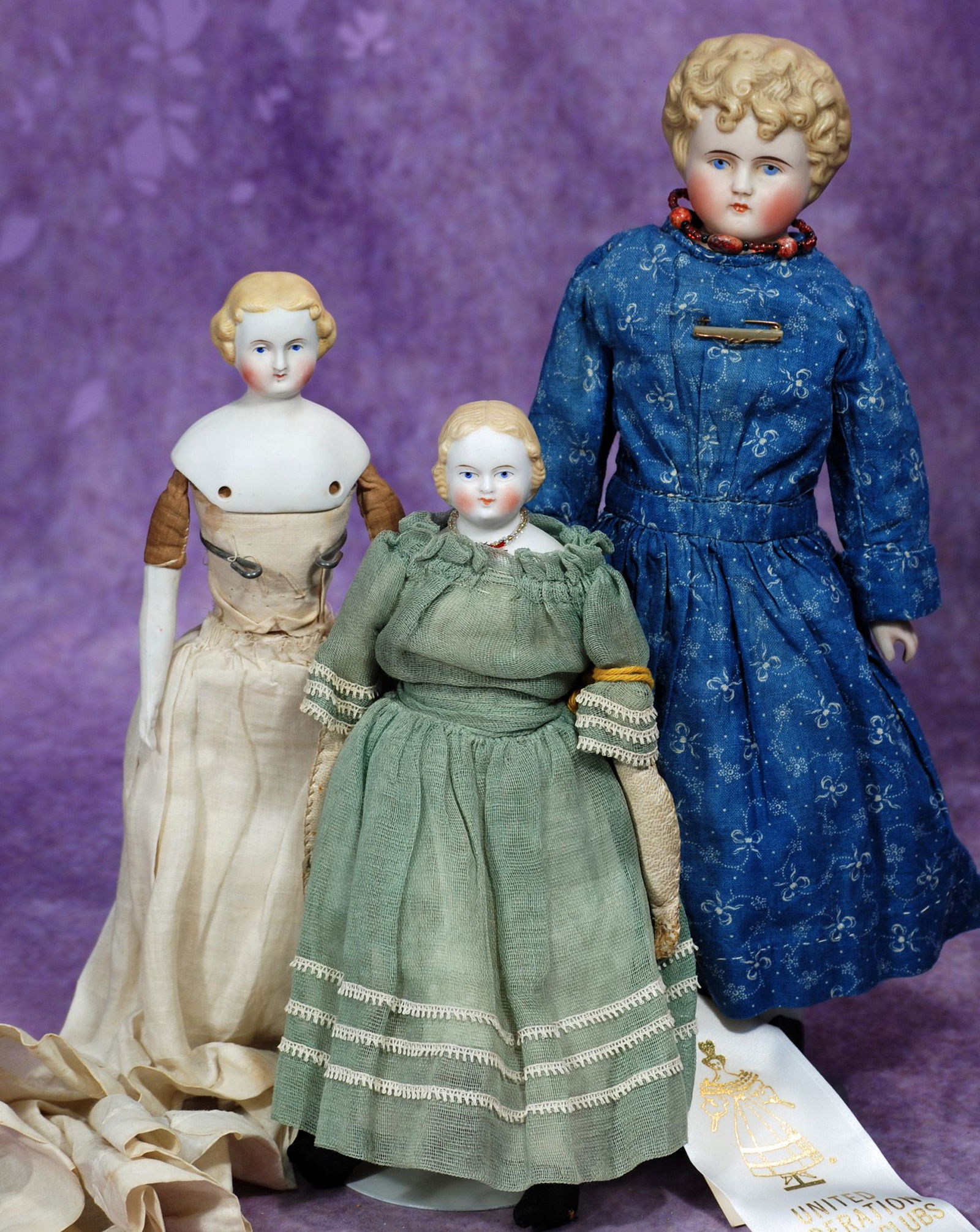 THREE GERMAN BISQUE LADIES WITH SCULPTED HAIR.  8 ½” to 12”.  Each is bisque (1 of 1)
