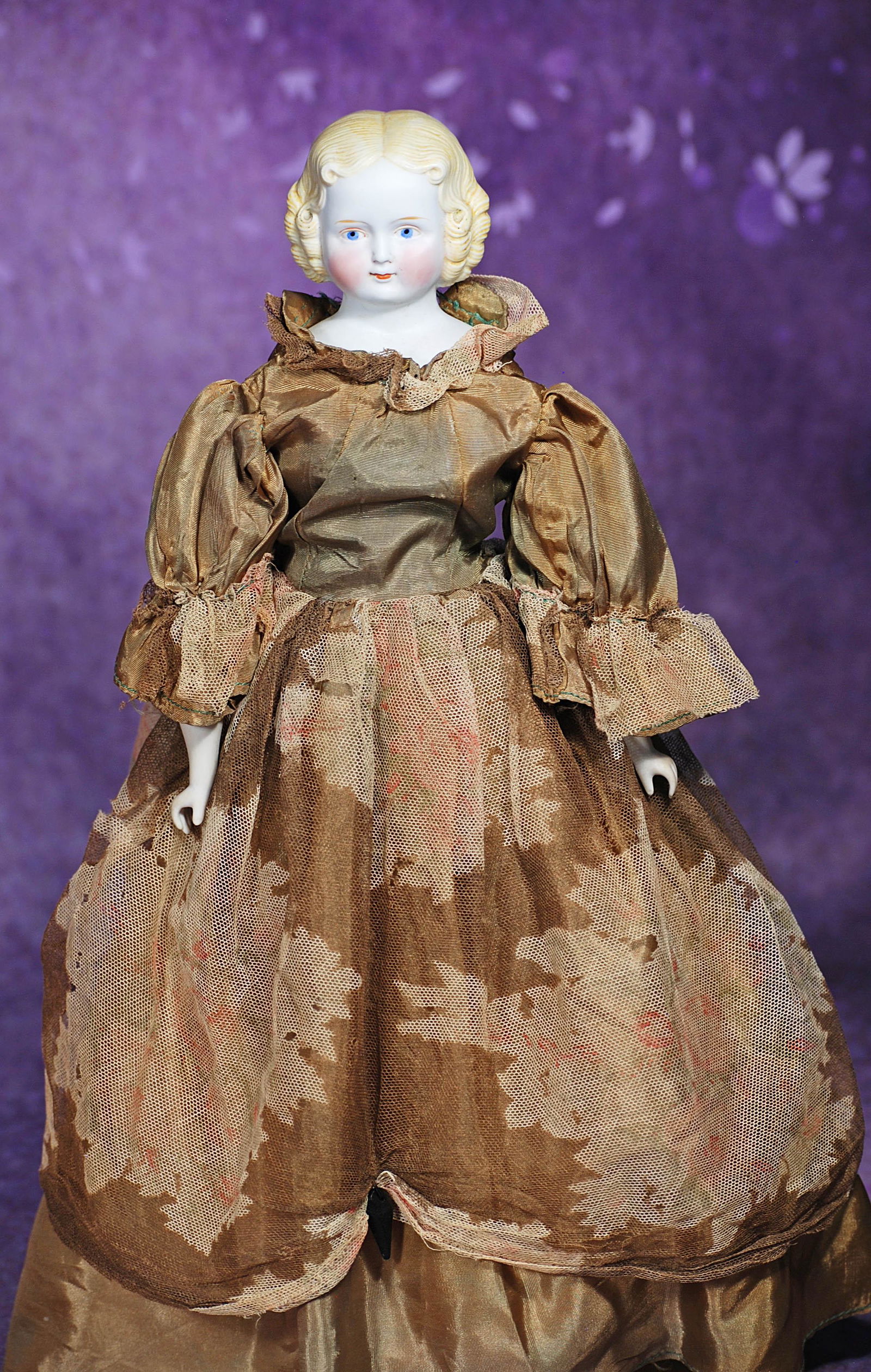 GERMAN BISQUE LADY WITH SCULPTED BLONDE HAIR. 15”. Bisque shoulderhead with deeply-sculpted: GERMAN BISQUE LADY WITH SCULPTED BLONDE HAIR. 15”. Bisque shoulderhead with deeply-sculpted blonde hair, painted features, blue eyes, tapered brows, closed mouth, cloth body, bisque lower limbs,