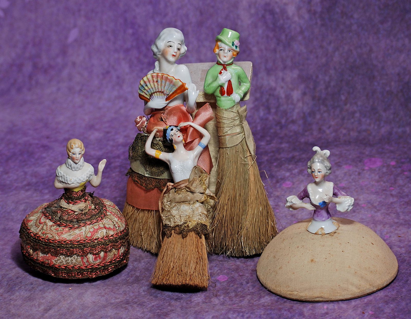 B.  HALF DOLL GROUP.  8” German porcelain hat brush with arms away and holding a fan, painted (1 of 1)