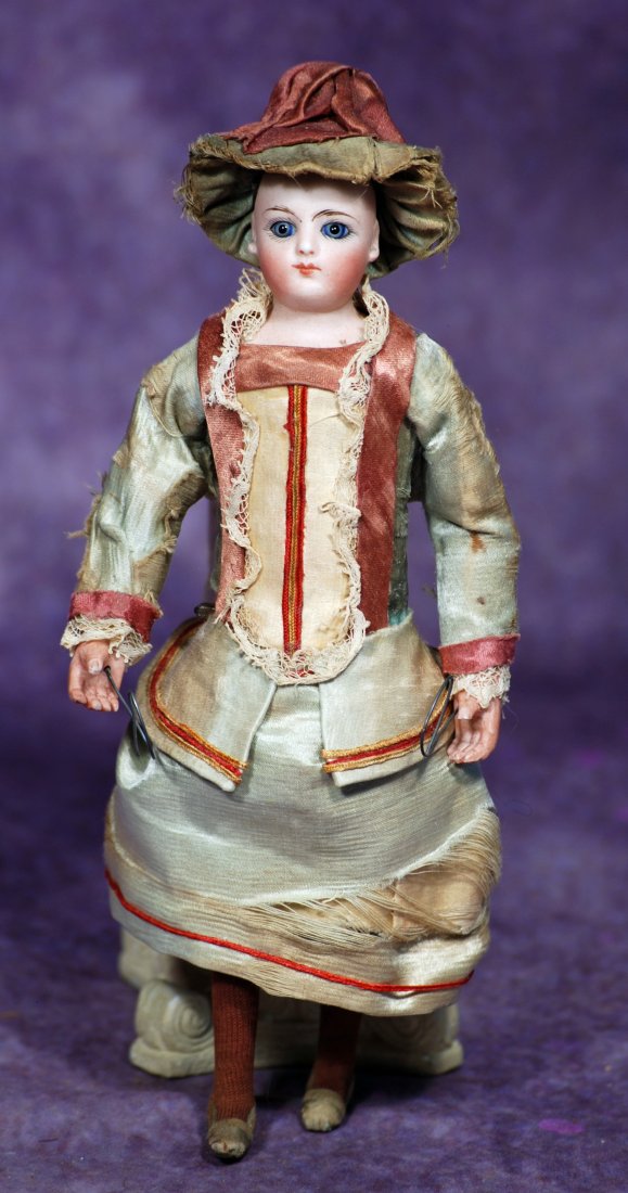 FRENCH BISQUE DOLL IN ORIGINAL COSTUME.  9”.  Marks: None visible.  Bisque shoulderhead, blue (1 of 1)
